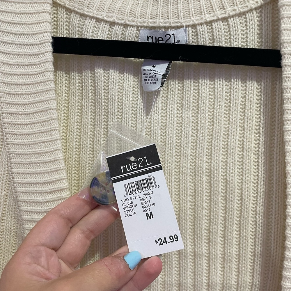 Rue 21 sweater vest. NEW WITH TAGS. Never worn before. Cream color with buttons.
